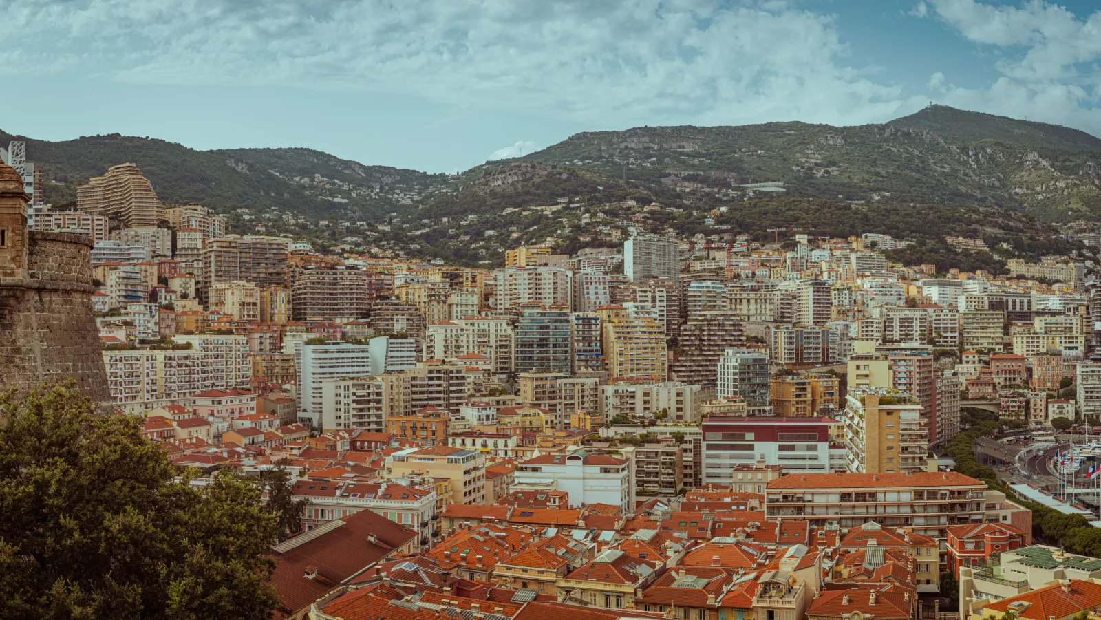 Aerial view of Port Hercule and the Monaco waterfront with the town rising behind the quays