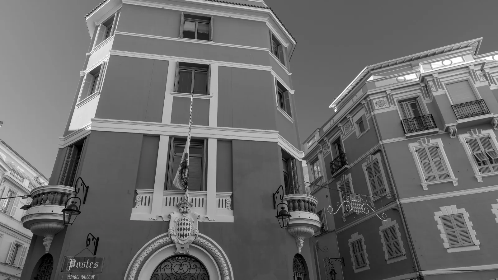 Shopfronts and awnings along a Condamine street in Monaco on an ordinary working morning