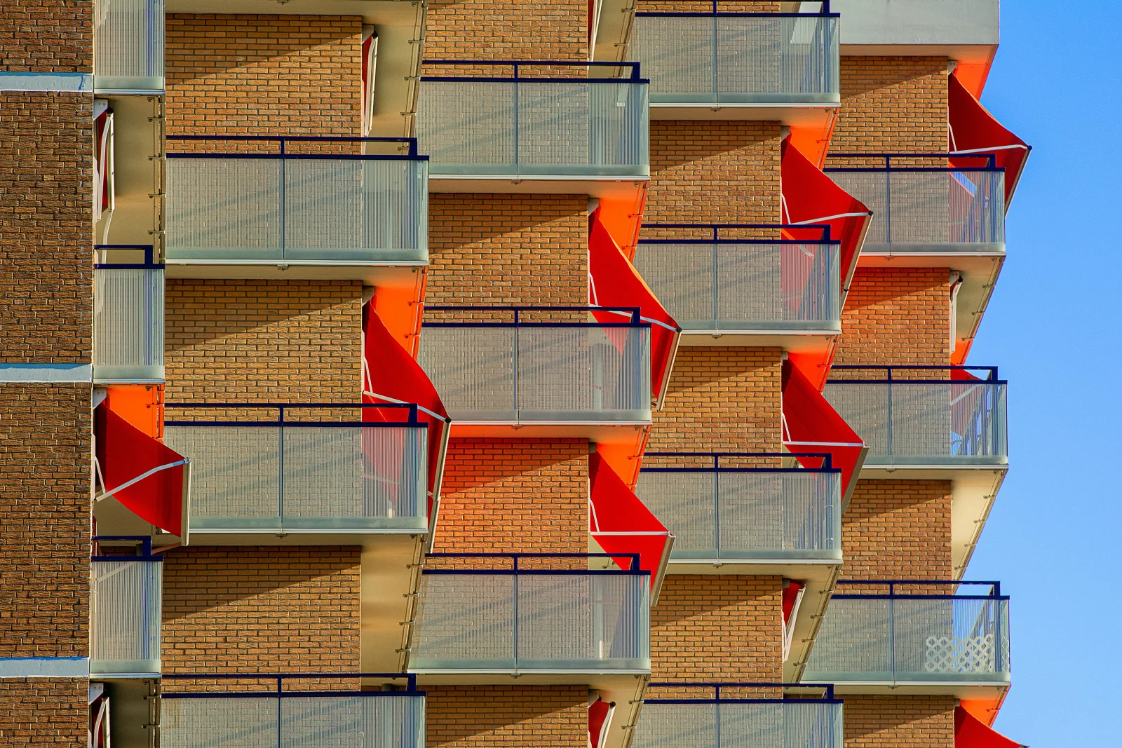 Balconies and shutters on a residential building facade in the Monte-Carlo district