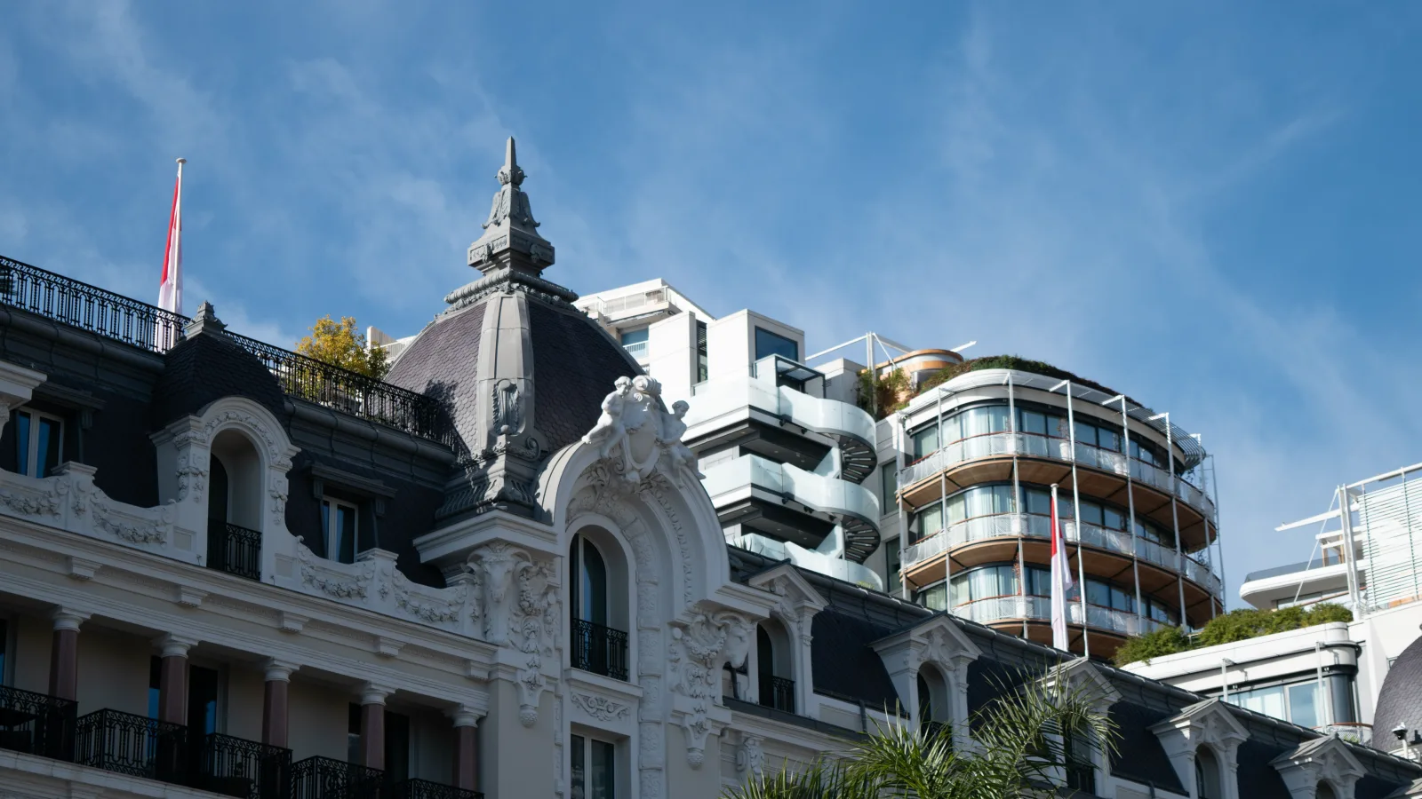Stone and glass office facades on a Monte Carlo street in daylight