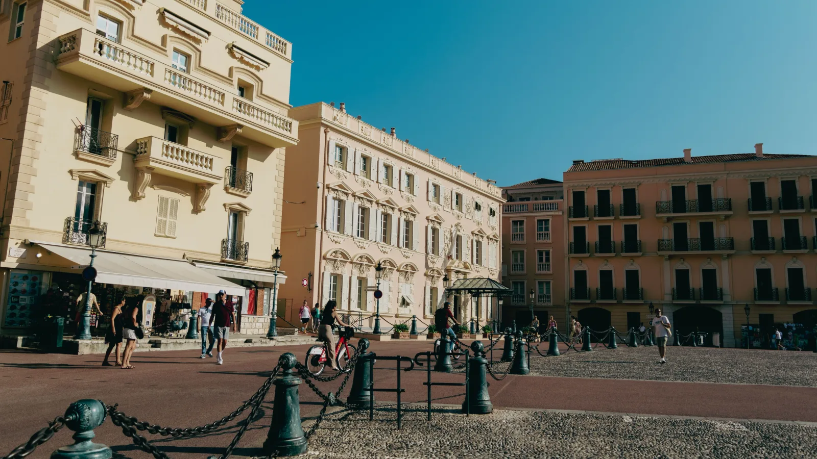 Apartment facades on a residential street in the Monte-Carlo district of Monaco in daylight.